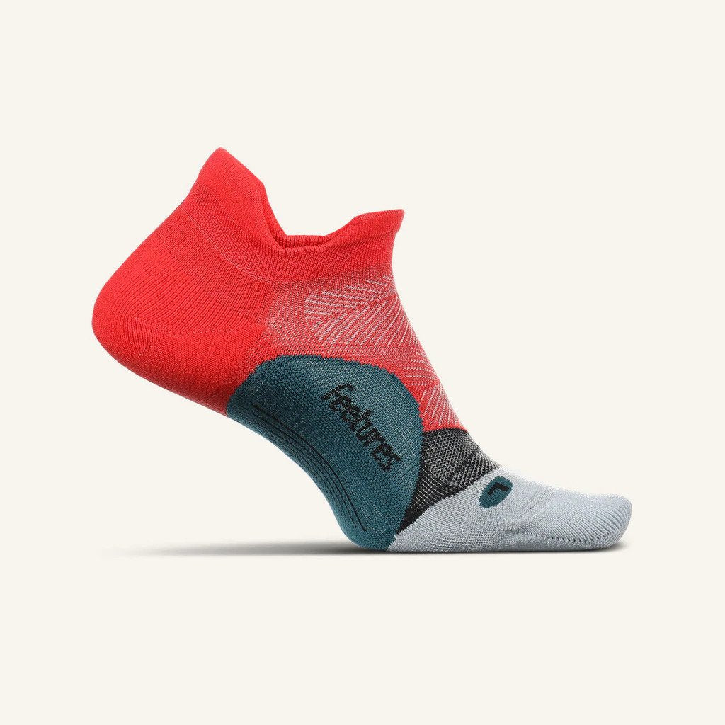 Medial view of the Feetures Elite Light cushion no show tab sock in the color racing red