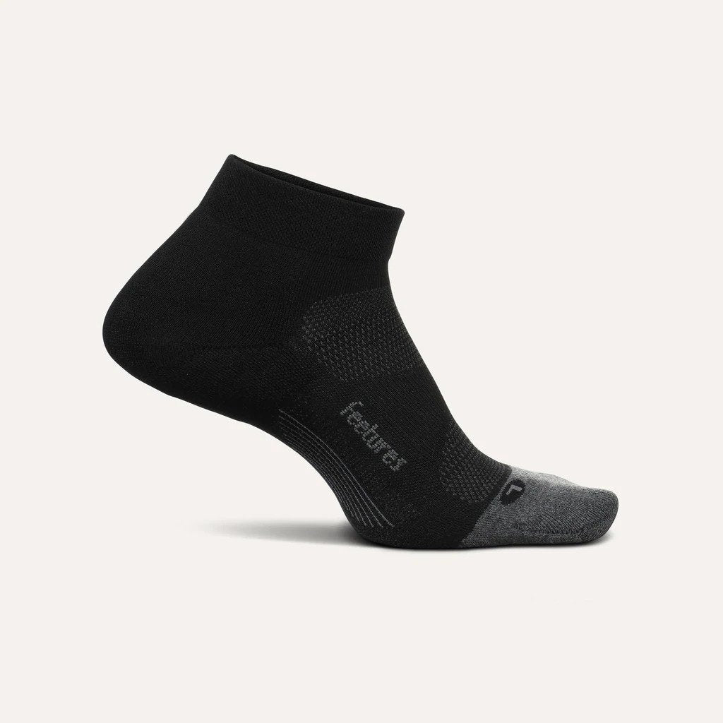 Medial view of the Feetures Elite Max cushion low cut sock in the color black
