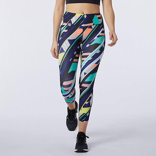 Front view of a model wearing the Women's Printed Impact Run Crop by New Balance in a Multi-colored print
