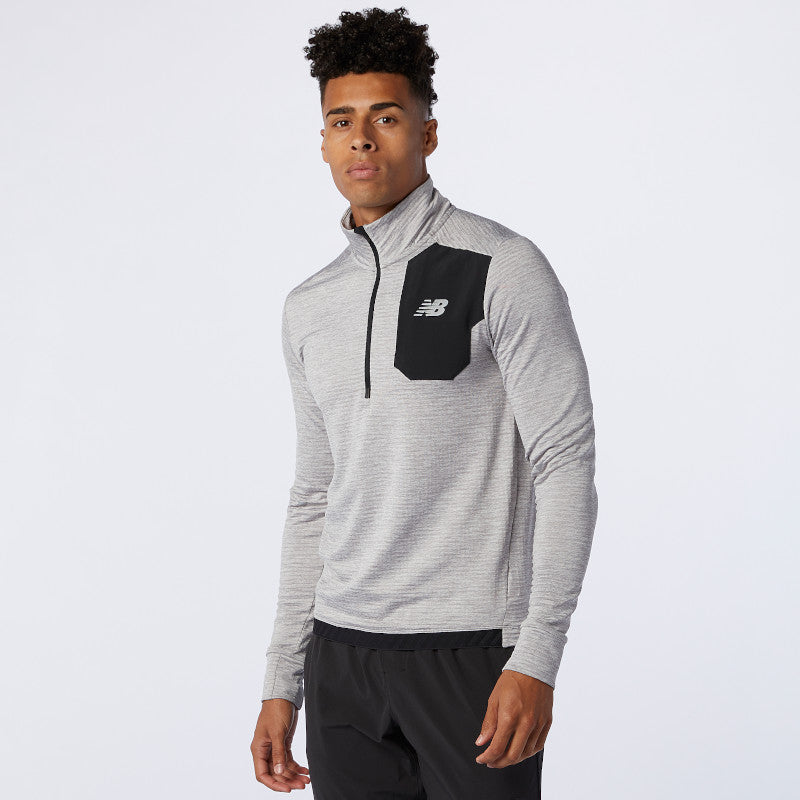 Front view of a model wearing the Men's Impact Run Heat Grid Half Zip in the color Athletic Grey