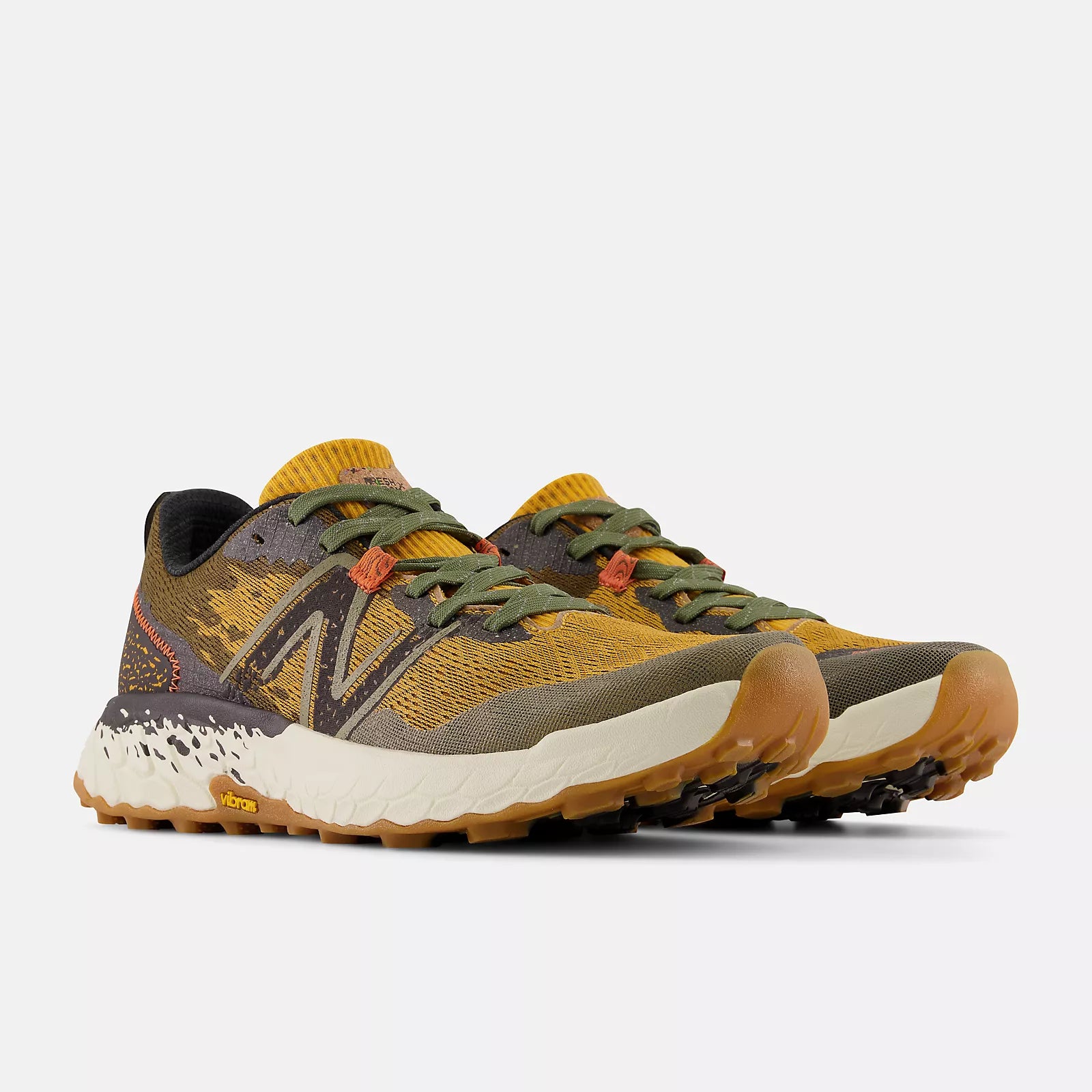Front angled view of the Men's Hierro V7 trail runner by New Balance in the color Golden hour/Dark Camo/Black