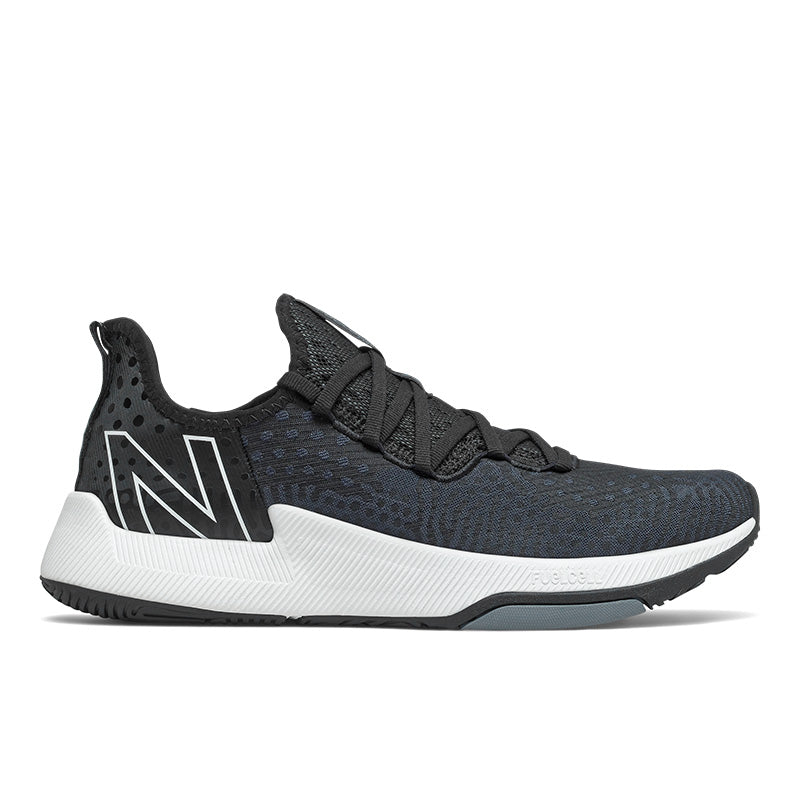 Lateral view of the Men's New Balance Fuel Cell trainer (right shoe) in the color Black