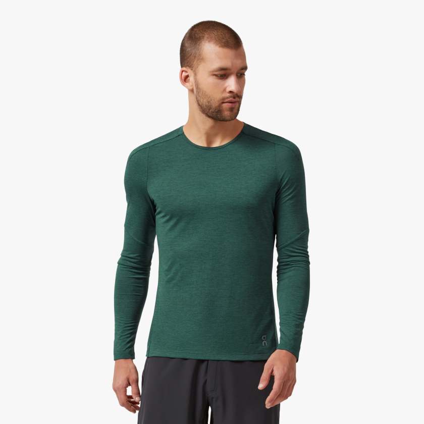 Front view of a model wearing the Men's Peformance Long Sleeve shirt by ON in the color Evergreen