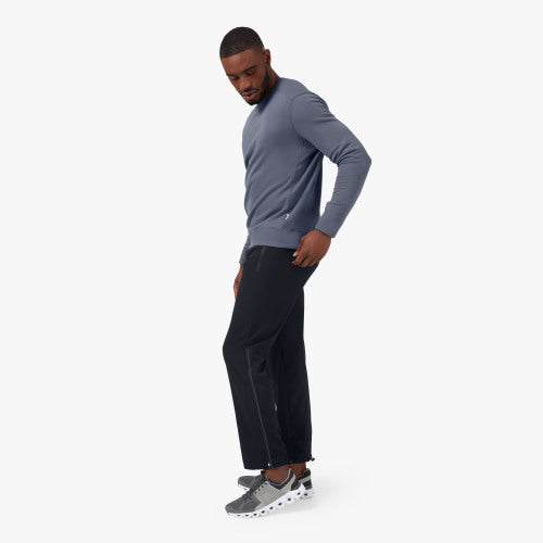 Side view of the Men's Track Pant by ON in the color Black