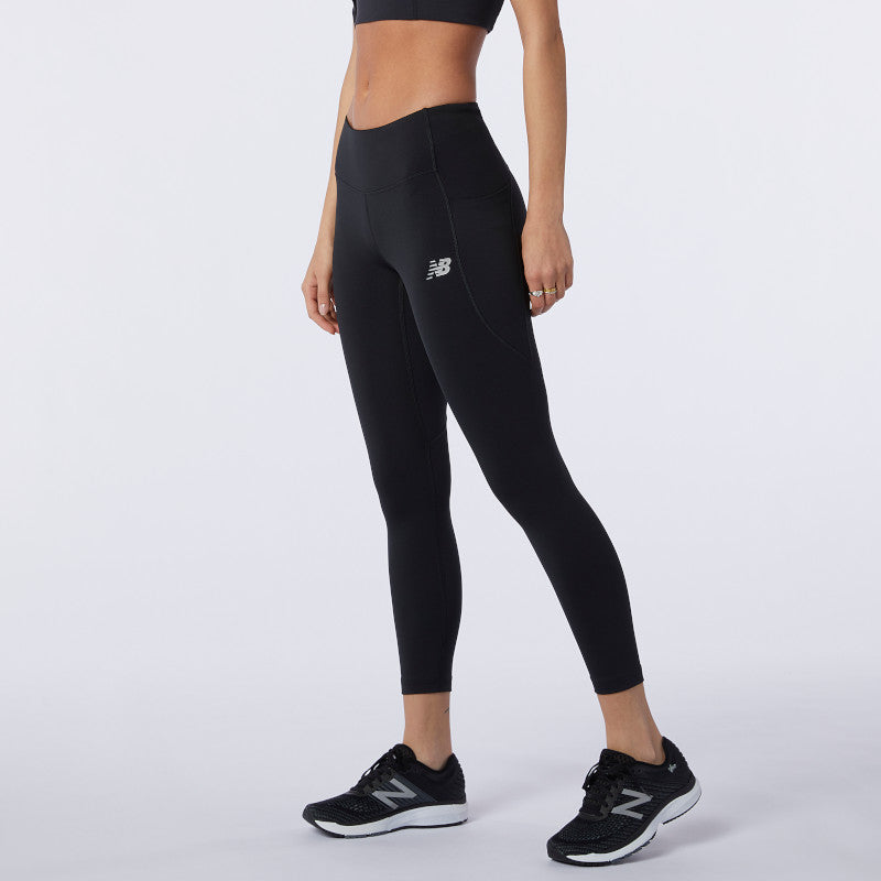 Side view of a model wearing the Women's Impact Run Crop by New Balance in Black