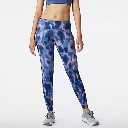 Front view of the Women's Printed Impact Run Tight in the color Night SkyThese women's workout leggings include drop-in hip pockets and a zippered back pocket to store your nutrition, phone, keys and more. Plus, the handy storage tunnel lets you thread extra layers through for a totally hands-free run. Finished with moisture-wicking NB DRYx for comfort and a print for a stylish touch.