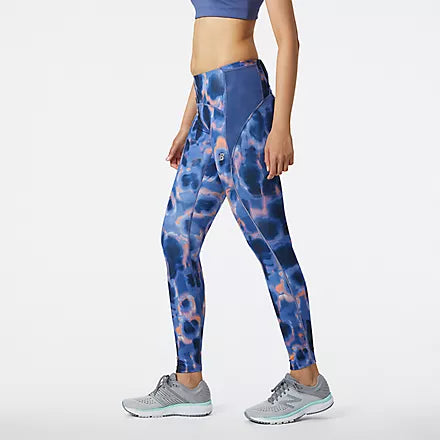 Side view of the Women's Printed Impact Run Tight in the color Night SkyThese women's workout leggings include drop-in hip pockets and a zippered back pocket to store your nutrition, phone, keys and more. Plus, the handy storage tunnel lets you thread extra layers through for a totally hands-free run. Finished with moisture-wicking NB DRYx for comfort and a print for a stylish touch.
