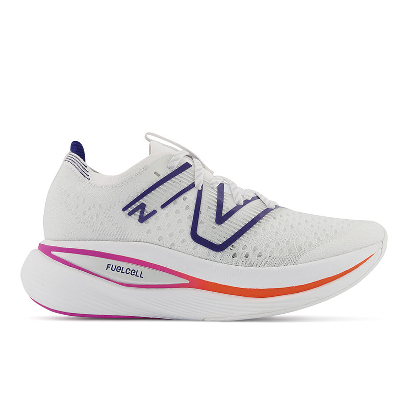 Lateral view of the New Balance Women's Fuel Cell SuperComp Trainer in the color White/Victory Blue/Magenta Pop