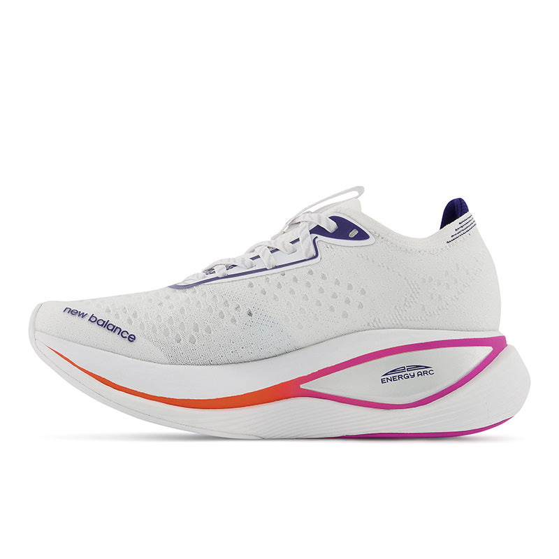 Medial view of the New Balance Women's Fuel Cell SuperComp Trainer in the color White/Victory Blue/Magenta Pop