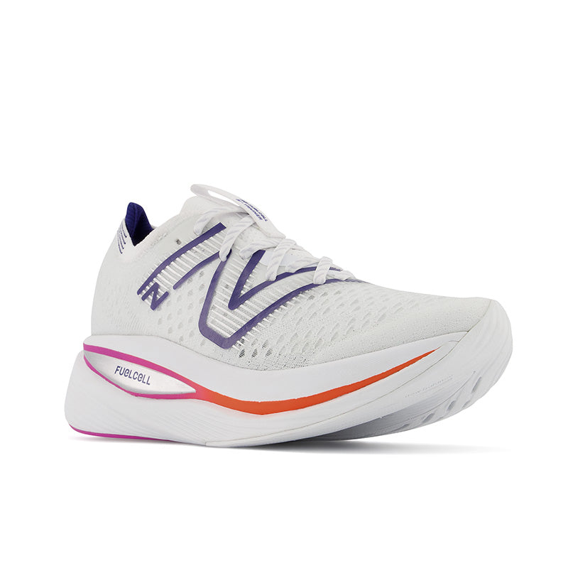 Front angled view of the New Balance Women's Fuel Cell SuperComp Trainer in the color White/Victory Blue/Magenta Pop