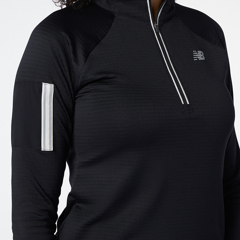 Don't let the cold weather stop you from getting outside for your run with the Impact Run Half Zip Heat Grid Pullover. This women's running top is packed with features to keep you warm, including NB HEAT technology and heat grid material. A hidden zipper pocket on the sleeve keeps keys and cards accessible, while reflective trims pop in the light.