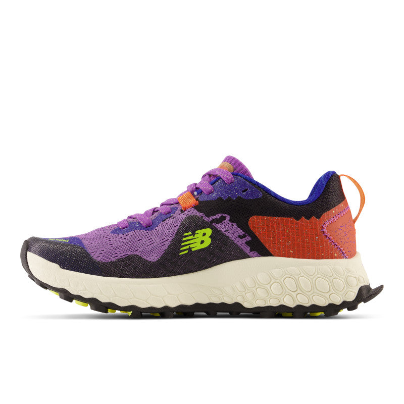 Medial view of the Women's Trail Hierro V7 by New Balance in the color Mystic Purple / Poppy