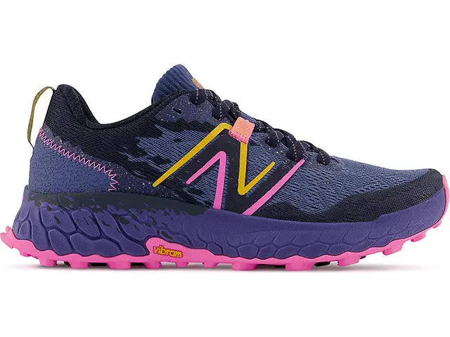 Lateral view of the Women's Trail Hierro V7 by New Balance in the color Night Sky / Vibrant Pink
