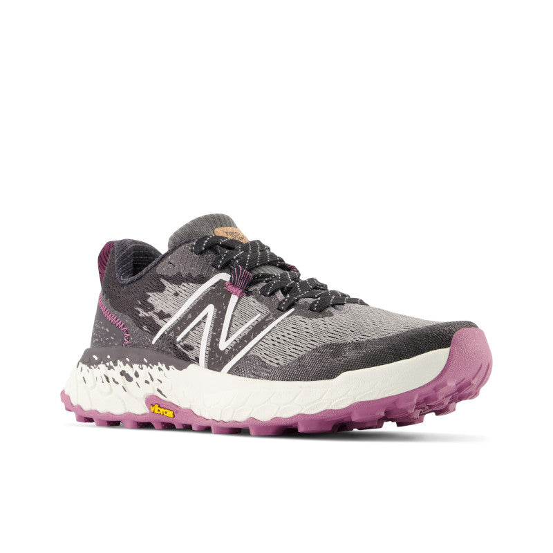 Front angled view of the Women's Trail Hierro V7 by New Balance in the color Castlerock with raisin
